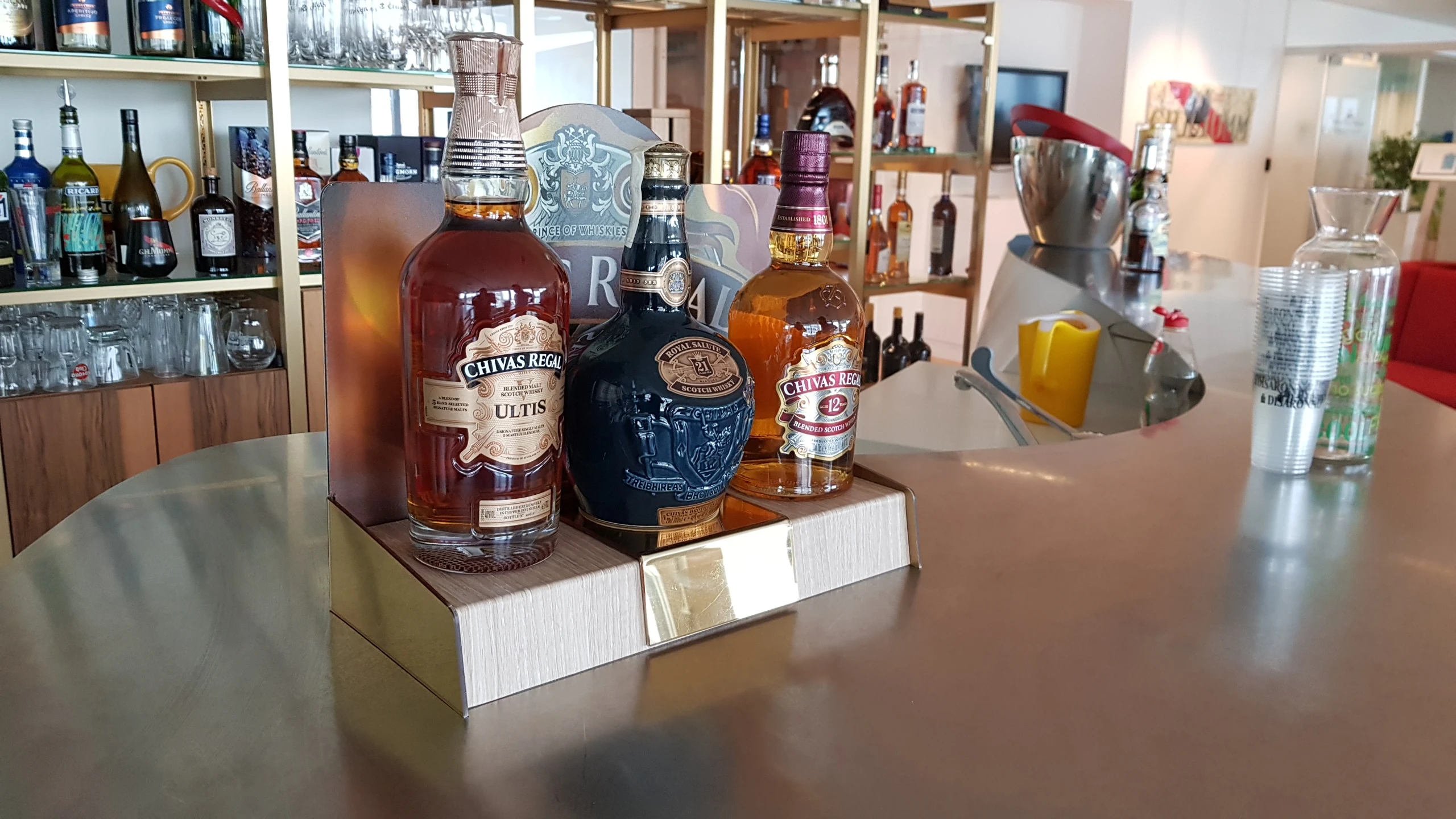 Chivas Regal · Royal Salute — Glorifier with three bottles on a presentation base