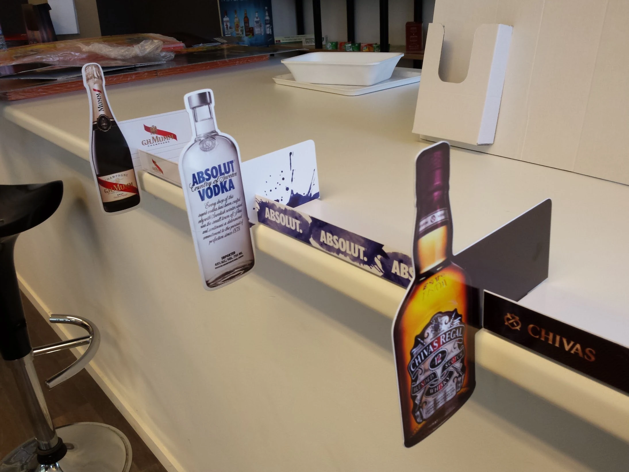 Mumm · Absolut · Chivas — Shelf dividers with bottle silhouettes