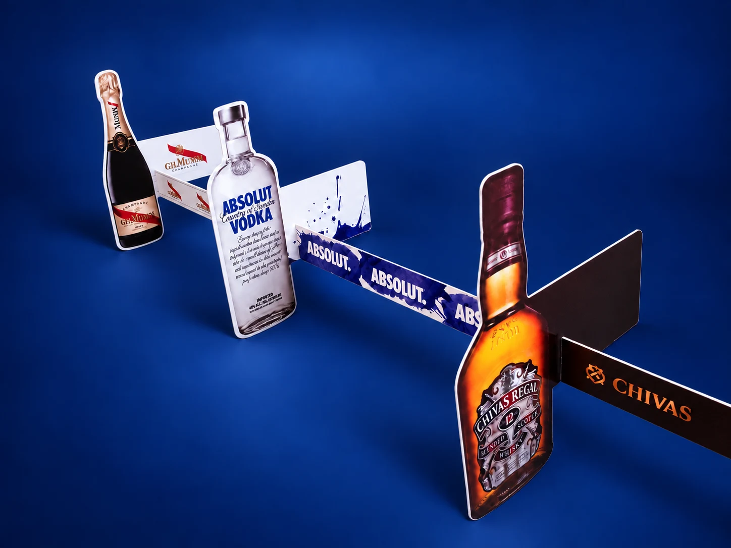 Mumm · Absolut · Chivas — Shelf dividers with bottle silhouettes